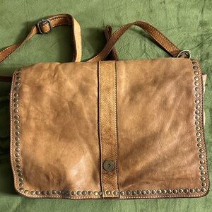 Patina cognac leather bag. Messenger flap crossbody style by Costanza Rota.